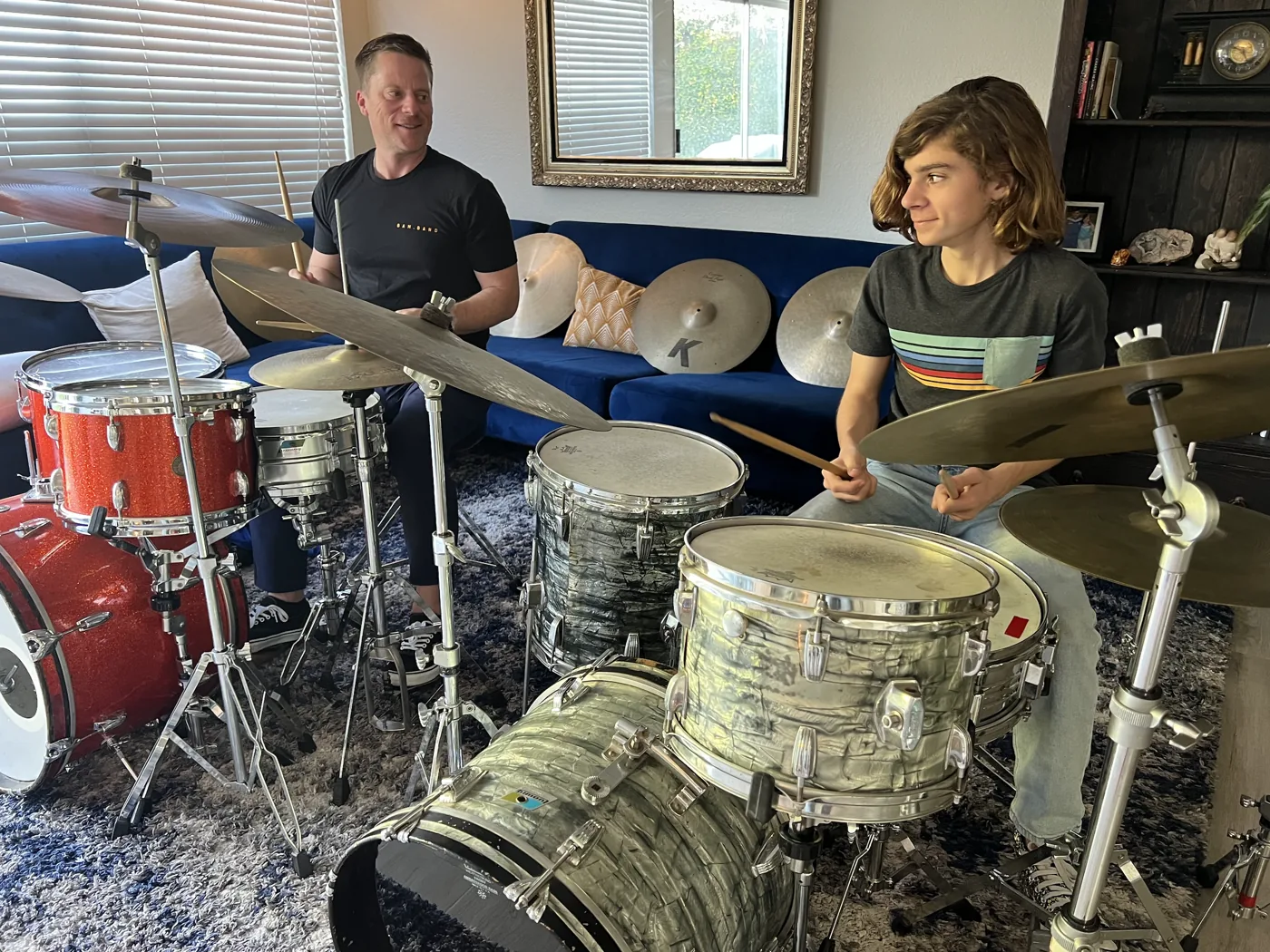 OC Drum Academy instructor leading a young drummer during a kids group class in Tustin